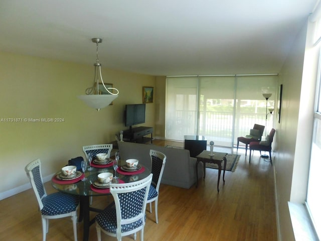 dining room with wood-type flooring