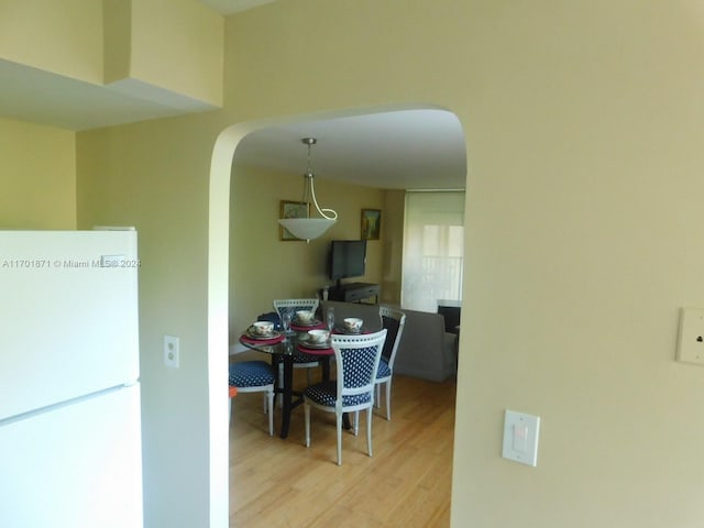 dining area featuring light wood-type flooring