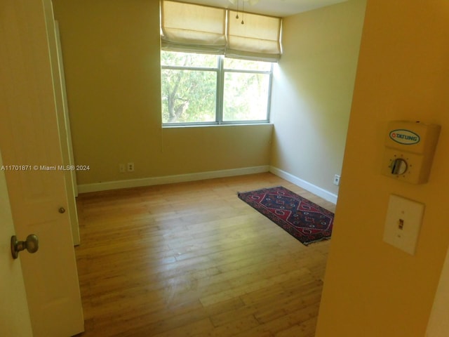 empty room with light wood-type flooring