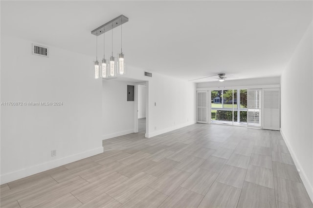 unfurnished living room with ceiling fan, light hardwood / wood-style floors, and electric panel