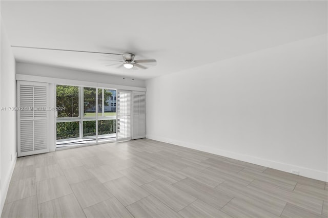 spare room with ceiling fan