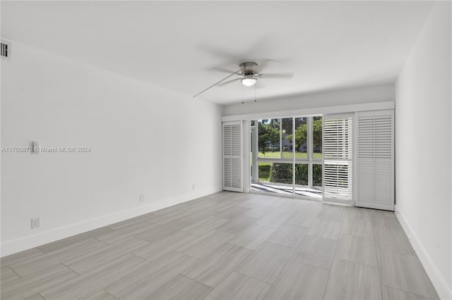 unfurnished room with ceiling fan