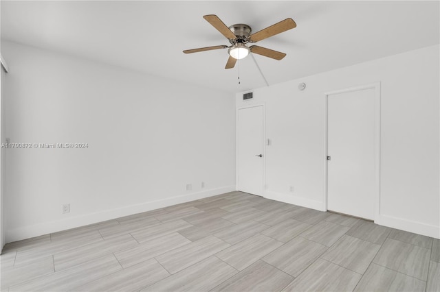 empty room with ceiling fan