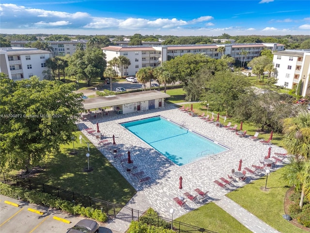 view of pool with a yard and a patio