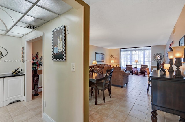 hallway featuring light tile patterned flooring