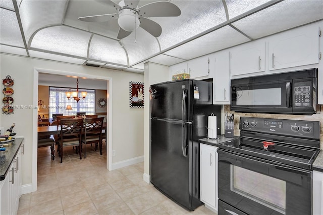 kitchen featuring hanging light fixtures, white cabinets, light tile patterned flooring, black appliances, and ceiling fan with notable chandelier