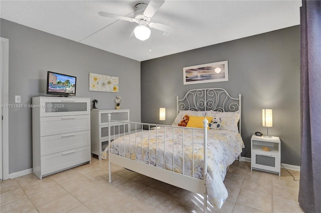 bedroom featuring ceiling fan and light tile patterned flooring