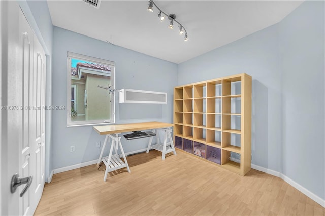 office area with wood-type flooring