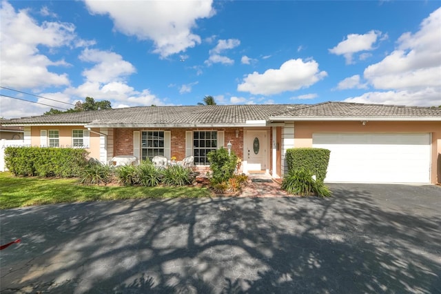 single story home featuring a garage