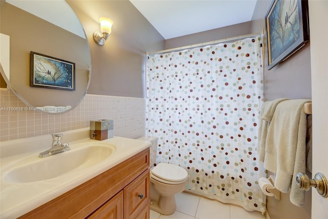 bathroom featuring tile patterned flooring, tile walls, a shower with shower curtain, vanity, and toilet