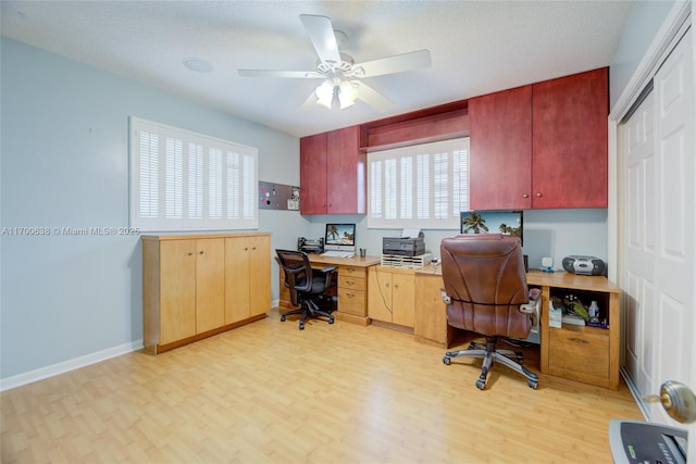 office with ceiling fan, a textured ceiling, and light wood-type flooring