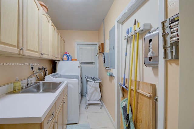 washroom featuring sink, light tile patterned floors, electric panel, cabinets, and washing machine and clothes dryer