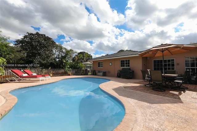 view of pool featuring a patio