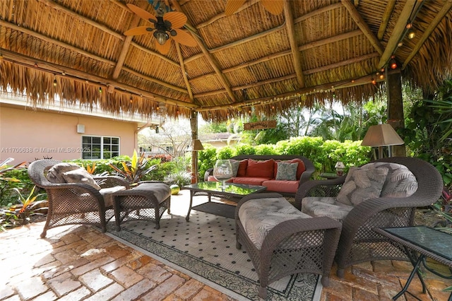 view of patio with a gazebo, ceiling fan, and outdoor lounge area