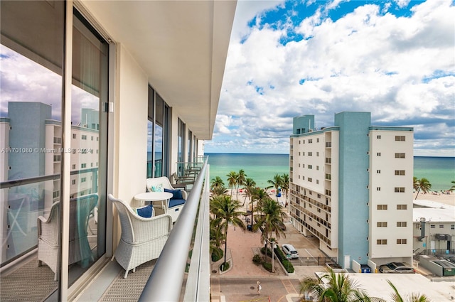 balcony featuring a water view