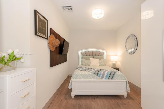 bedroom with light hardwood / wood-style floors