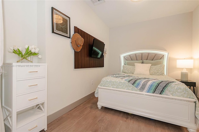 bedroom featuring wood-type flooring