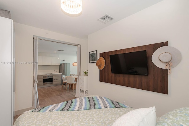 bedroom featuring light wood-type flooring