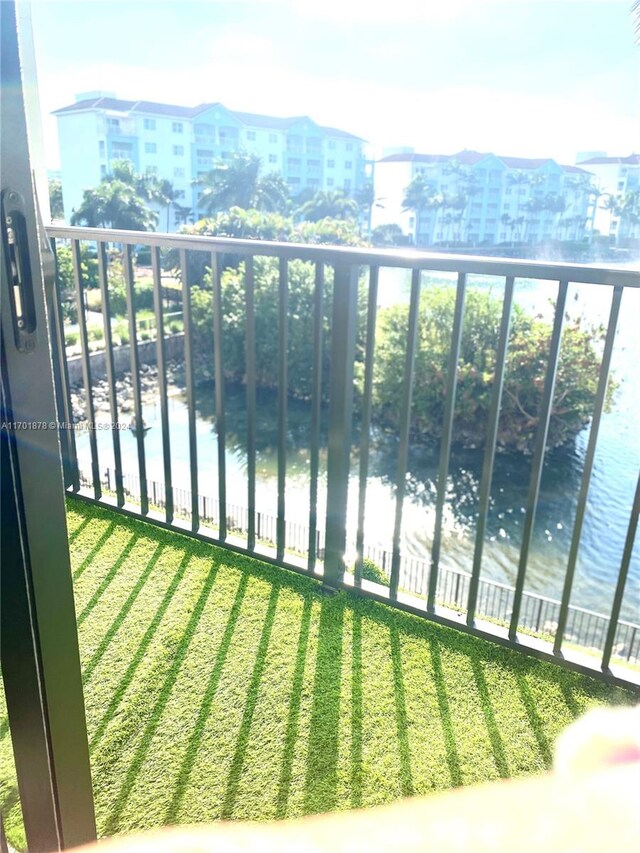 balcony featuring a water view