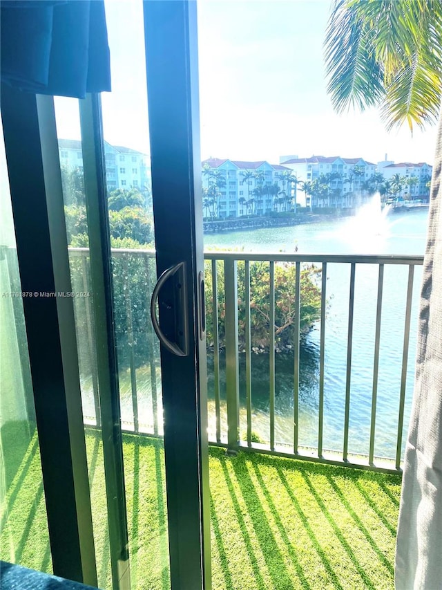 balcony featuring a water view