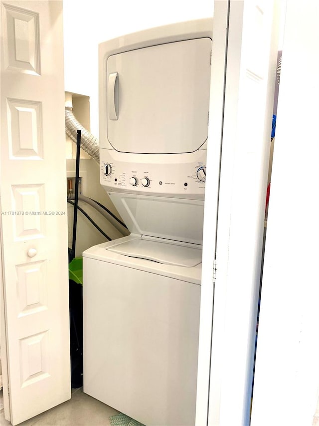 laundry area featuring stacked washer and dryer