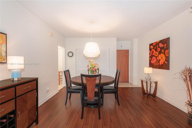 dining room with dark hardwood / wood-style floors