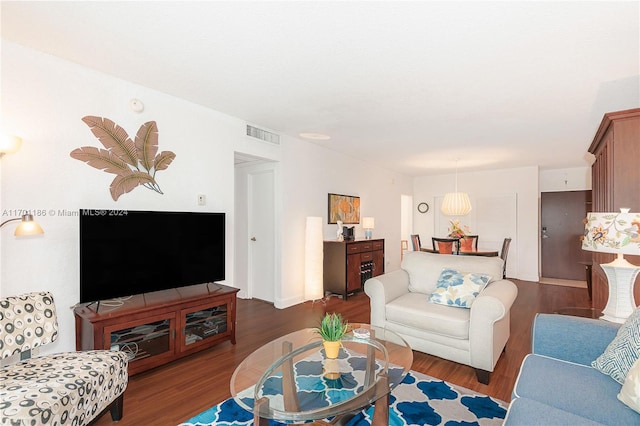 living room with dark hardwood / wood-style floors