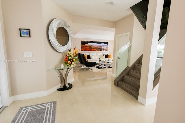 hall featuring light tile patterned floors