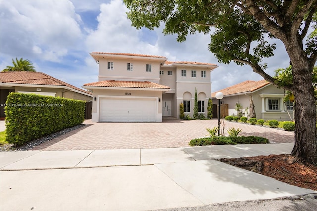 mediterranean / spanish house featuring a garage