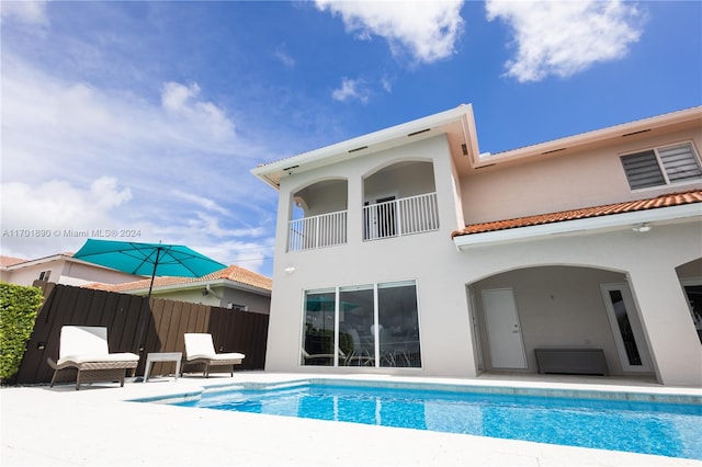 rear view of property featuring a patio area