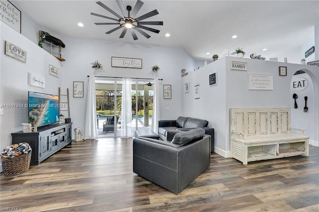 living room featuring ceiling fan, high vaulted ceiling, and dark wood-type flooring