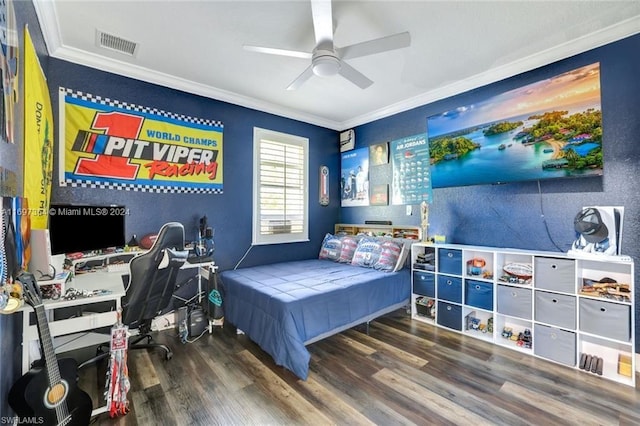 bedroom featuring ceiling fan, crown molding, and wood-type flooring