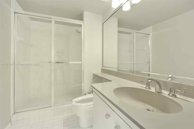 bathroom featuring tile patterned flooring, vanity, walk in shower, and toilet