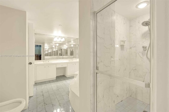 bathroom featuring vanity and a shower with door