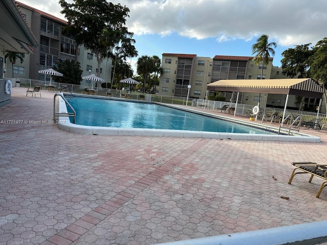 view of swimming pool with a patio area