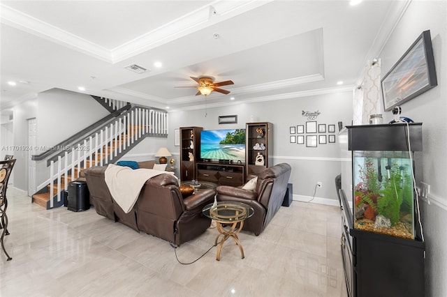 living room with crown molding, ceiling fan, and a raised ceiling