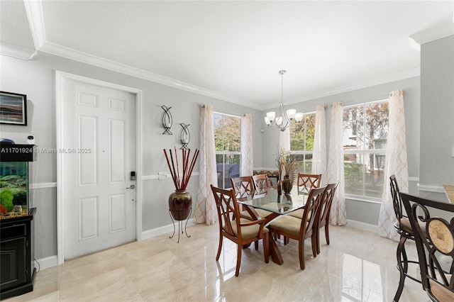 dining area featuring ornamental molding and a notable chandelier