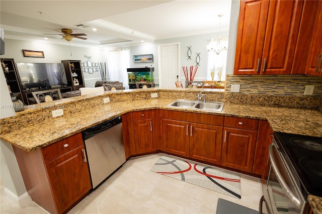 kitchen featuring pendant lighting, stone counters, ceiling fan with notable chandelier, sink, and appliances with stainless steel finishes