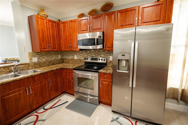 kitchen with backsplash, dark stone counters, stainless steel appliances, crown molding, and sink