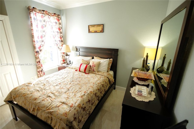 bedroom with wood-type flooring and ornamental molding