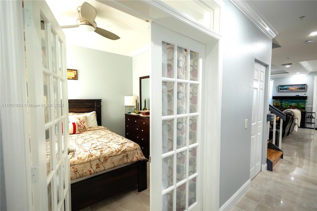 bedroom featuring ceiling fan, crown molding, and french doors