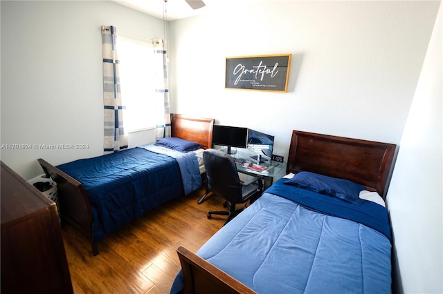 bedroom featuring hardwood / wood-style flooring and ceiling fan