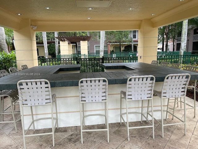 view of patio featuring a bar