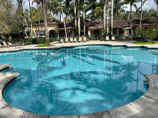 view of swimming pool with a patio area