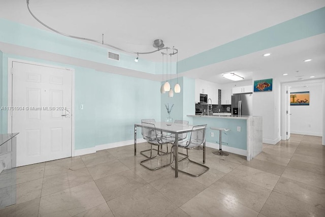 dining space featuring sink