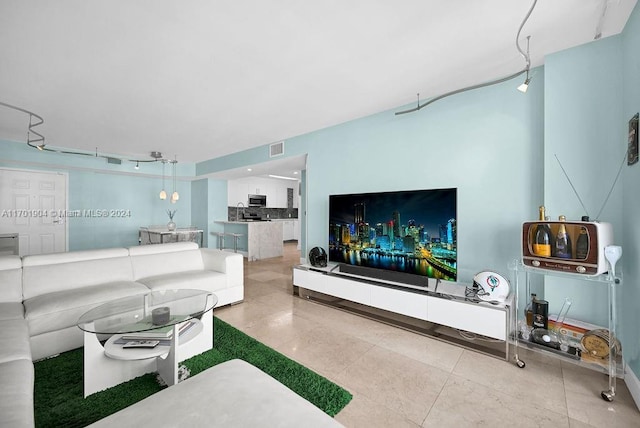 living room with tile patterned flooring