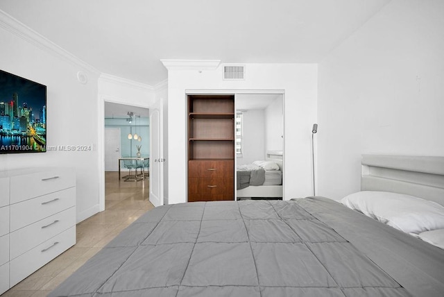 bedroom featuring a closet and ornamental molding