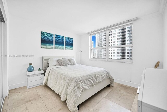 walk in closet with light tile patterned floors