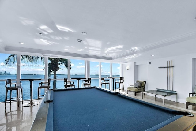 exercise room with a water view, a raised ceiling, and billiards