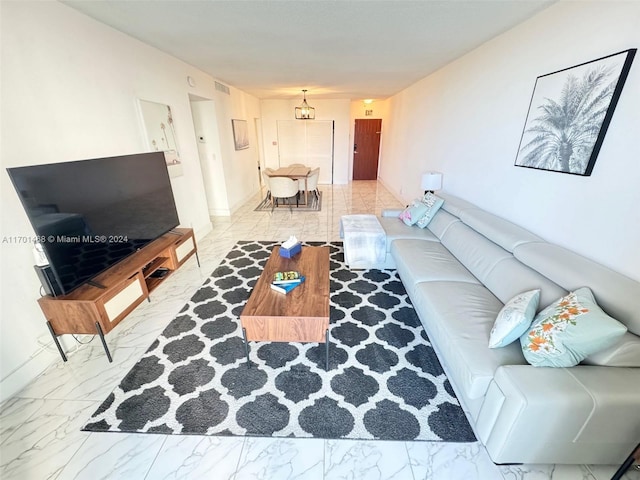 living room featuring an inviting chandelier